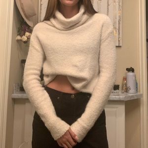 Knitted baggy neck sweater.